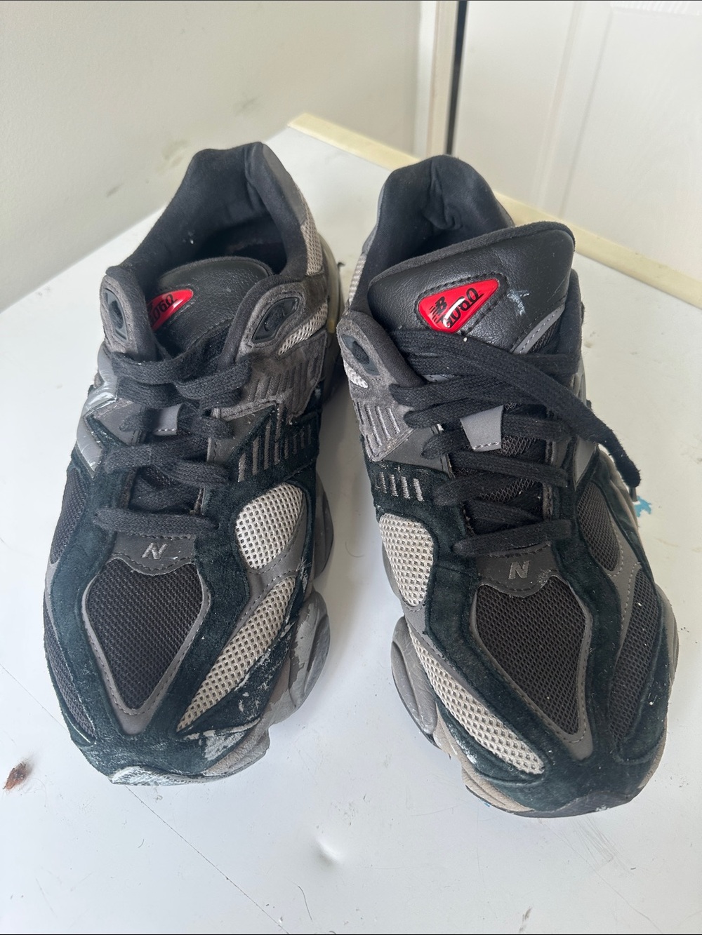 New Balance Men's Black and Gray Athletic Sneakers with Red Accent